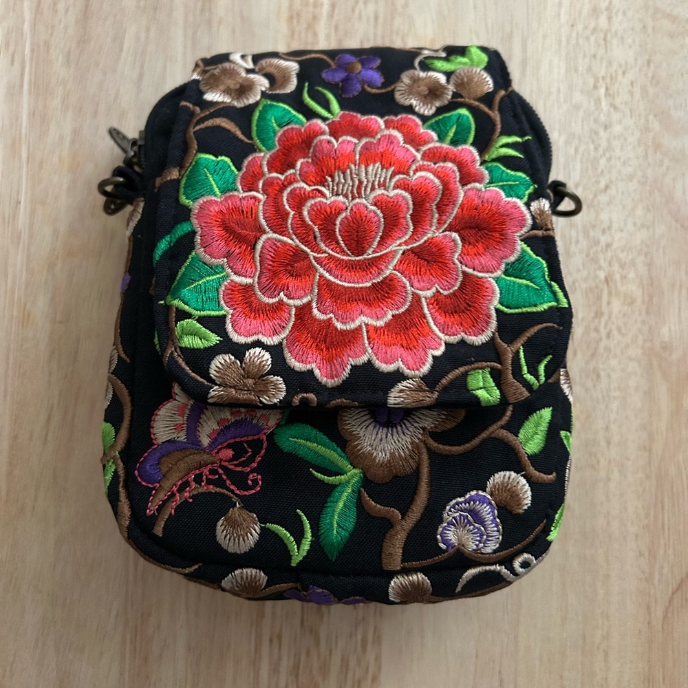 Colorful Crossbody Bag with Floral Embroidery. It has no purse strap. 3 pockets.
